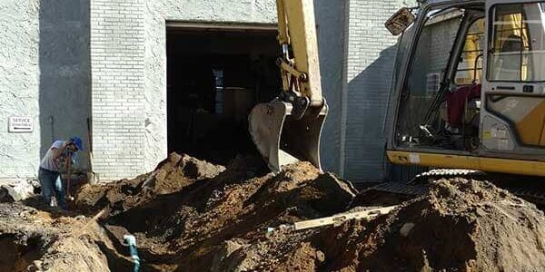 Excavator digging foundation for new house